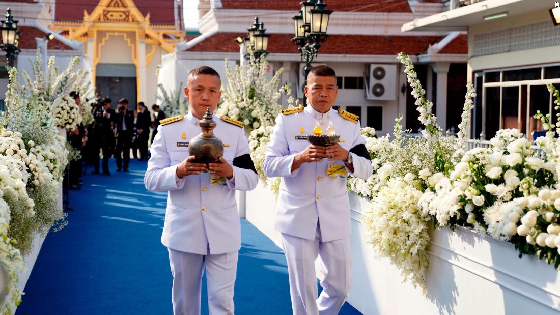 Royal palace officials participate in Buddhist funeral rituals for Srivaddhanaprabha.