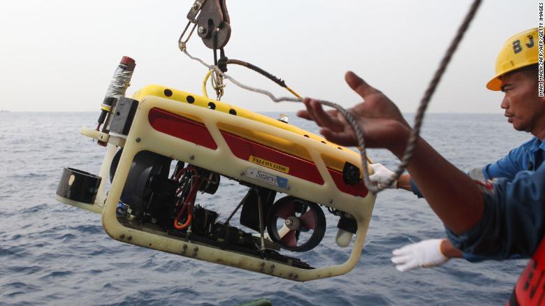 A remotely operated underwater vehicle is prepared for a search of Flight 610's cockpit voice recorder.