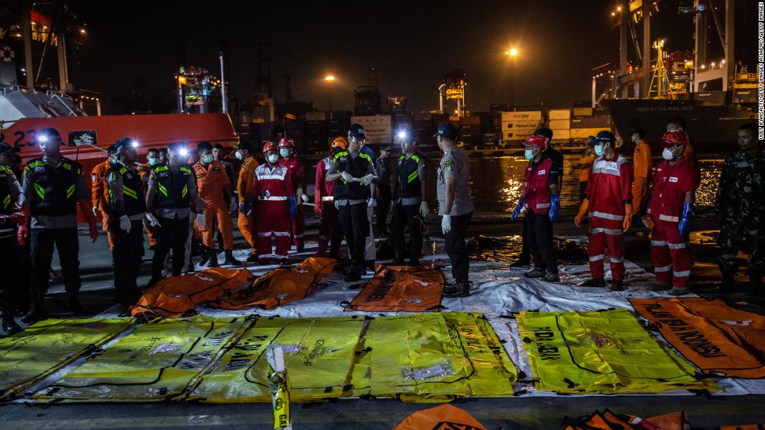 Body bags are laid out at Jakarta&#39;s Tanjung Priok port on November 3.