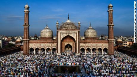 Indian Muslims offer Eid al-Adha prayers at the Jama Masjid mosque in New Delhi on August 22, 2018. - Muslims are celebrating Eid al-Adha (the feast of sacrifice), the second of two Islamic holidays celebrated worldwide marking the end of the annual pilgrimage or Hajj to the Saudi holy city of Mecca. (Photo by CHANDAN KHANNA / AFP)        (Photo credit should read CHANDAN KHANNA/AFP/Getty Images)