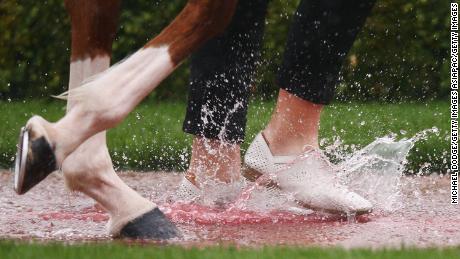 Water builds up in the mounting yard before race 2 during Melbourne Cup Day at Flemington Racecourse on November 6, 2018.