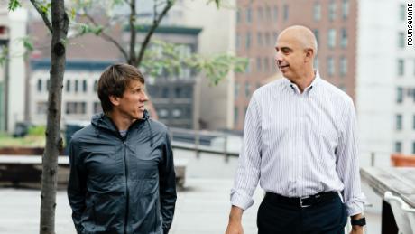 Crowley (left) walks with his chief financial officer, Rory Parness.