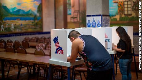 LOS ANGELES, CA - NOVEMBER 08: Latinos vote at a polling station in El Gallo Restaurant on November 8, 2016 in the Boyle Heights section of Los Angeles, California. In addition to choosing between Republican Donald Trump or Democrat Hillary Clinton for President of the United States, Californians are deciding on 17 ballot propositions.   (Photo by David McNew/Getty Images)