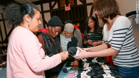 Socks and toiletries are handed out at a women's shelter on the Upper East Side in New York.