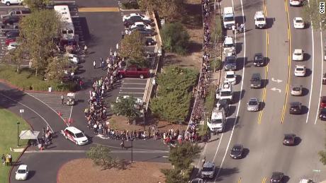 Hundreds of people wait in line to give blood at La Reina High School in Thousand Oaks, California, on Thursday after a gunman walked into the Borderline Bar and Grill and killed 12 people. 