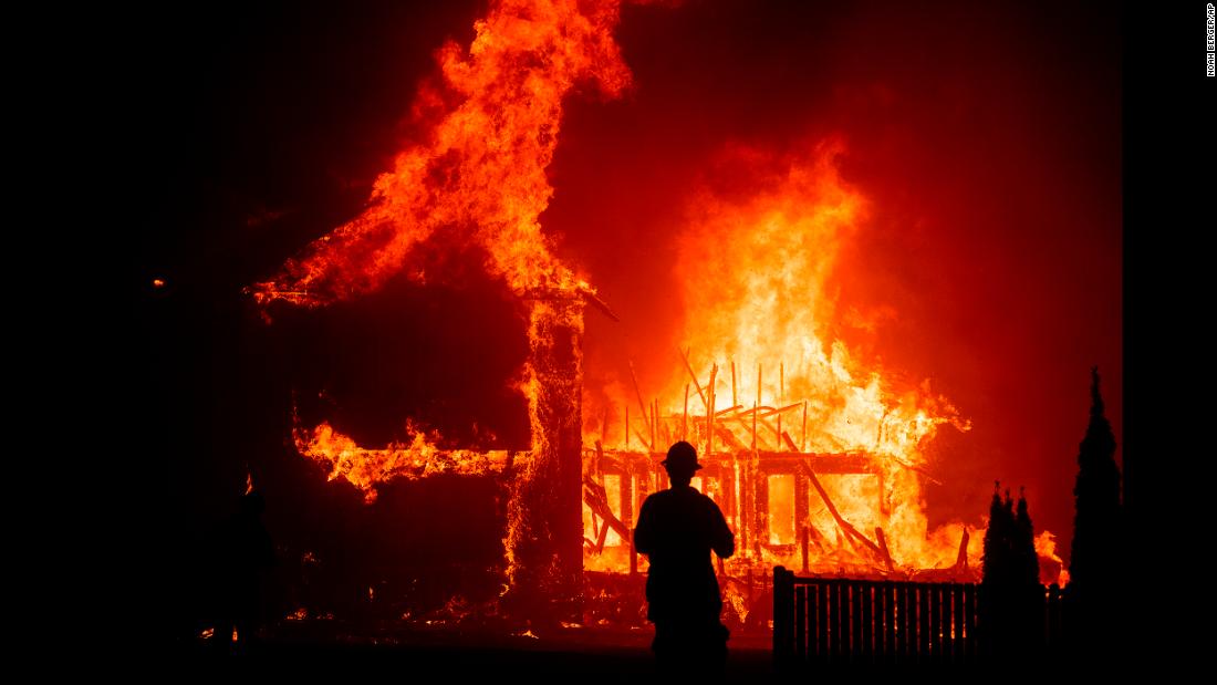 A home burns as the Camp Fire rages through Paradise.