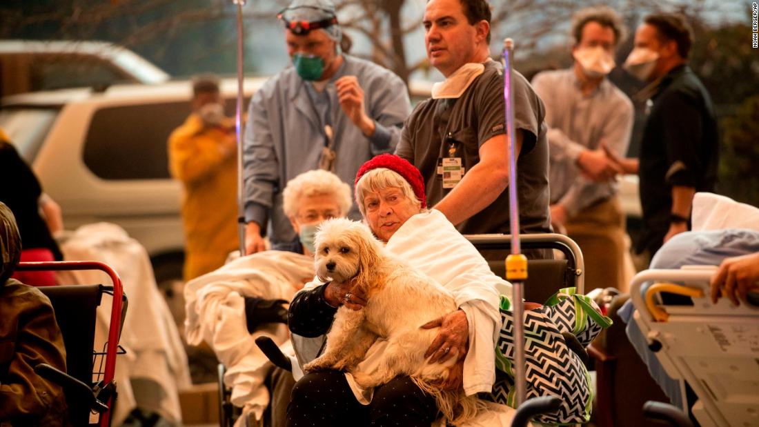 Medical personnel move patients as the Feather River Hospital is evacuated in Paradise on November 8.