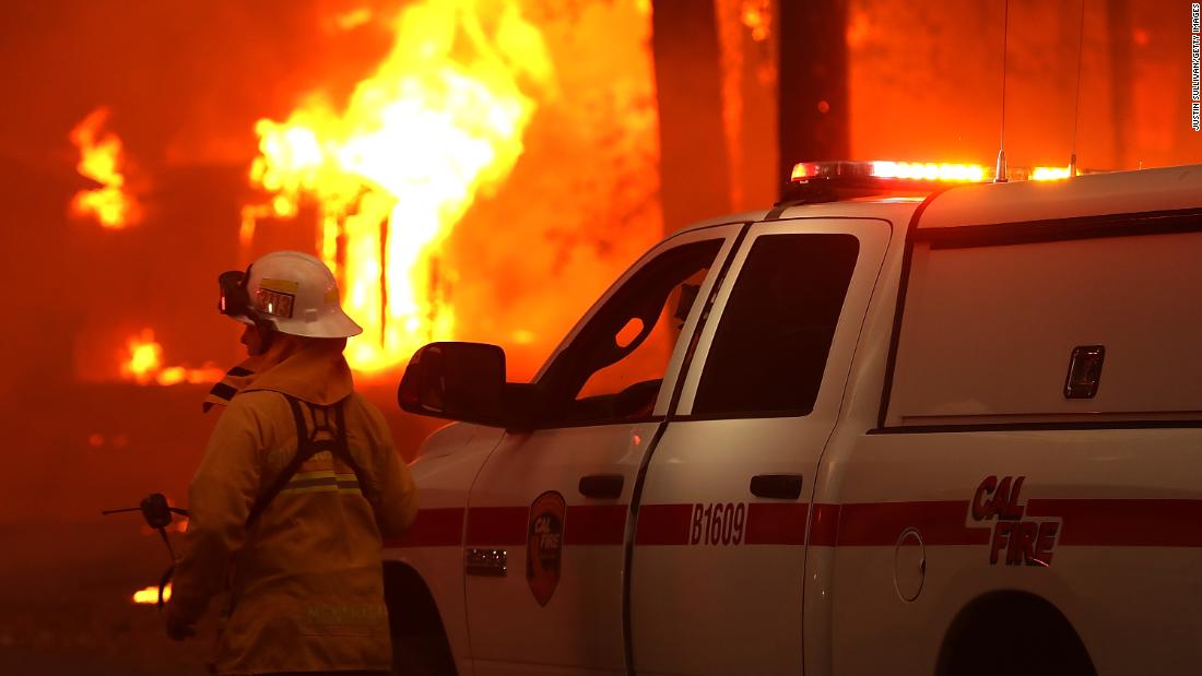 A firefighter monitors a burning home on November 8.