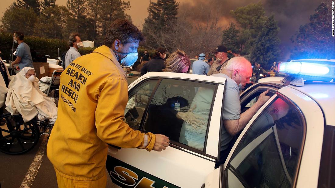 Hospital staff and first responders evacuate the Feather River Hospital in Paradise on November 8.