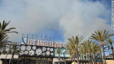 Smoke from a wildfire rises over the Los Angeles Zoo on Friday.