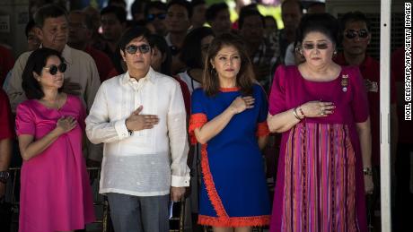 Ferdinand "Bongbong" Marcos Jr, former senator and son of the late Philippines dictator Ferdinand Marcos, his sister Imee and their mother, former first lady Imelda Marcos, listen to the national anthem during a wreath-laying ceremony at a monument to the late dictator during celebrations to mark his 100th birthday in Ilocos Norte province in 2017. 