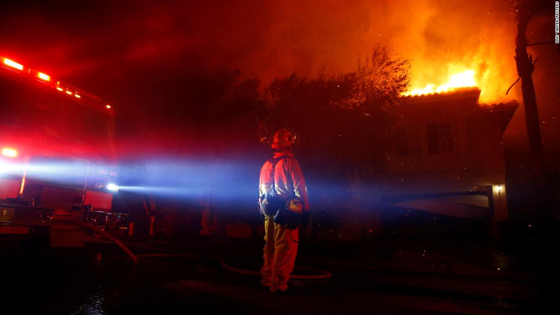 Firefighters battle flames in Thousand Oaks early on November 9.