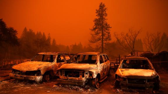 Cars destroyed by the Camp Fire sit in a used-car lot in Paradise on November 9.