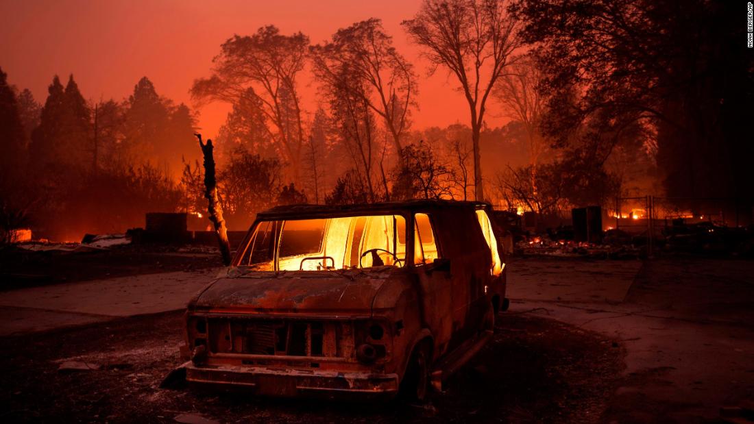 Flames burn inside a van as the Camp Fire tears through Paradise on November 8.