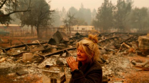 Cathy Fallon stands near the charred remains of her Paradise home on November 9. The Camp Fire has wiped out much of the town north of Sacramento.