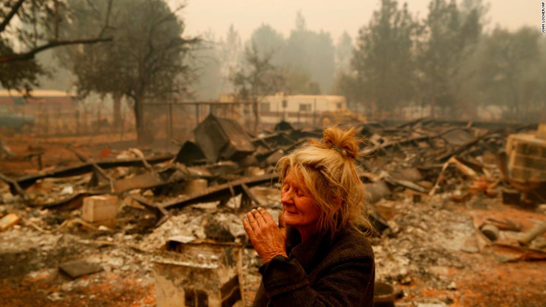 Cathy Fallon stands near the charred remains of her Paradise home on November 9. The Camp Fire has wiped out much of the town north of Sacramento.