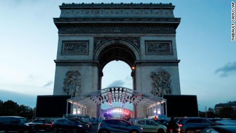 A stand is set up in front of the Arc de Triomphe in Paris ahead of ceremonies marking the 100th anniversary of the end of World War I.