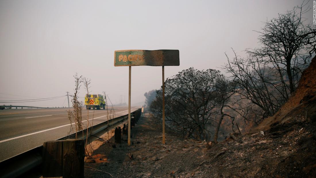 A fire truck is seen on the Pacific Coast Highway as the Woolsey Fire burns in Malibu on November 10.