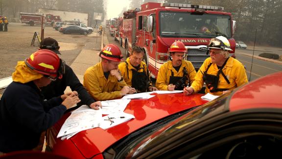 Firefighters meet in Paradise on November 10.