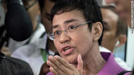 Maria Ressa speaks to the media as she arrives at the National Bureau of Investigation (NBI) headquarters in Manila on January 22, 2018. 