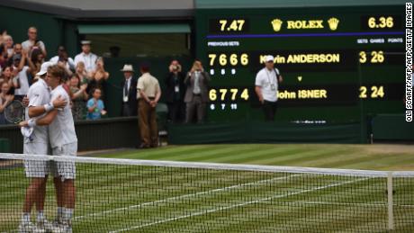 Kevin Anderson (right) and John Isner hug at the net after their six-and-a-half hour Wimbledon semifinal in July. 