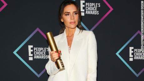 Victoria Beckham poses with the Fashion Icon Award.