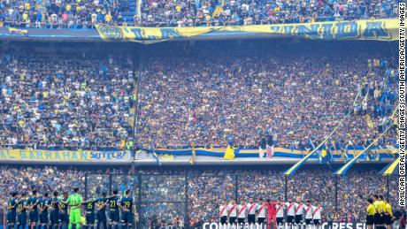 Boca Juniors and River Plate line up ahead of the first leg of the Copa Liberdatores final first leg at the Bombonera stadium in Buenos Aires. 