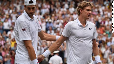 South Africa's Kevin Anderson (R) shakes hands after beating Isner in their six-and-a-half hour Wimbledon epic earlier in the year. 