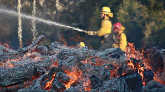 Firefighters work at the Salvation Army Camp in Malibu on Saturday, November 10.