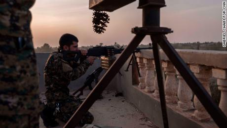 YPG fighters are seen on the frontline on October 18, in Baghoz, Syria, during an operation to retake the last stronghold of ISIS in Syria.