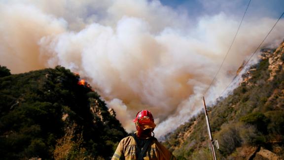 Firefighters battle the Woolsey Fire in Malibu on November 11.
