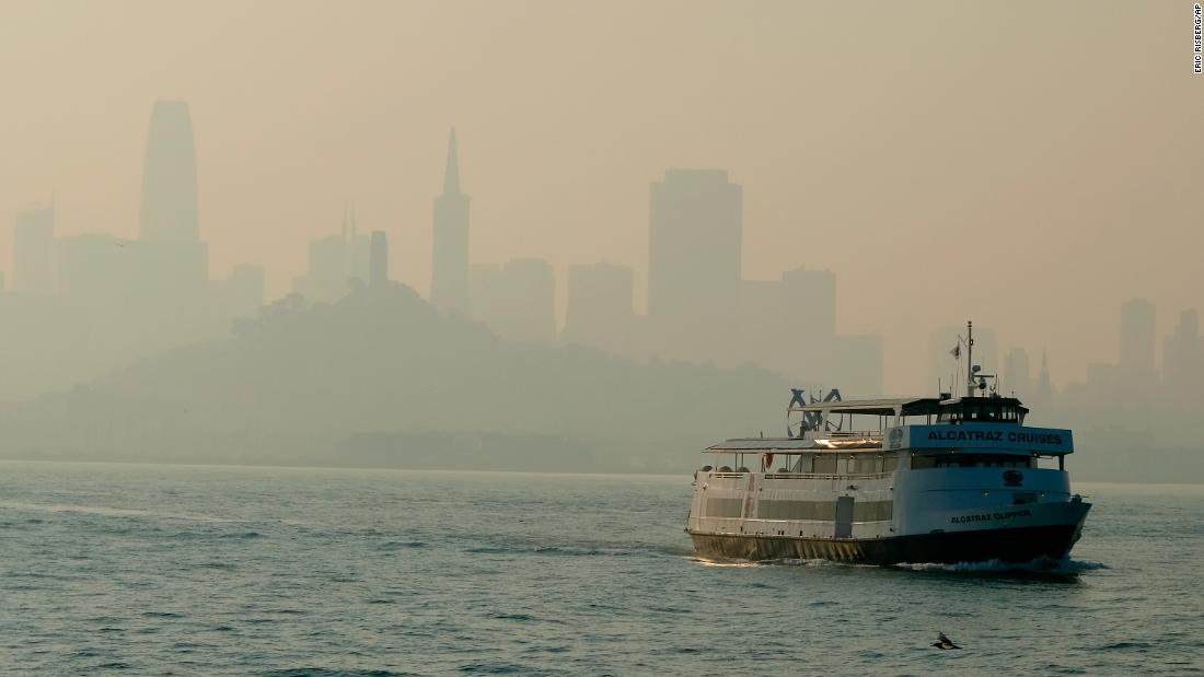 A ferry makes its way toward Alcatraz Island on November 12 as the San Francisco skyline is obscured by smoke that drifted over from the Camp Fire.