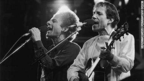 Simon and Garfunkel perform during a reunion concert at London's Wembley Stadium in 1982.