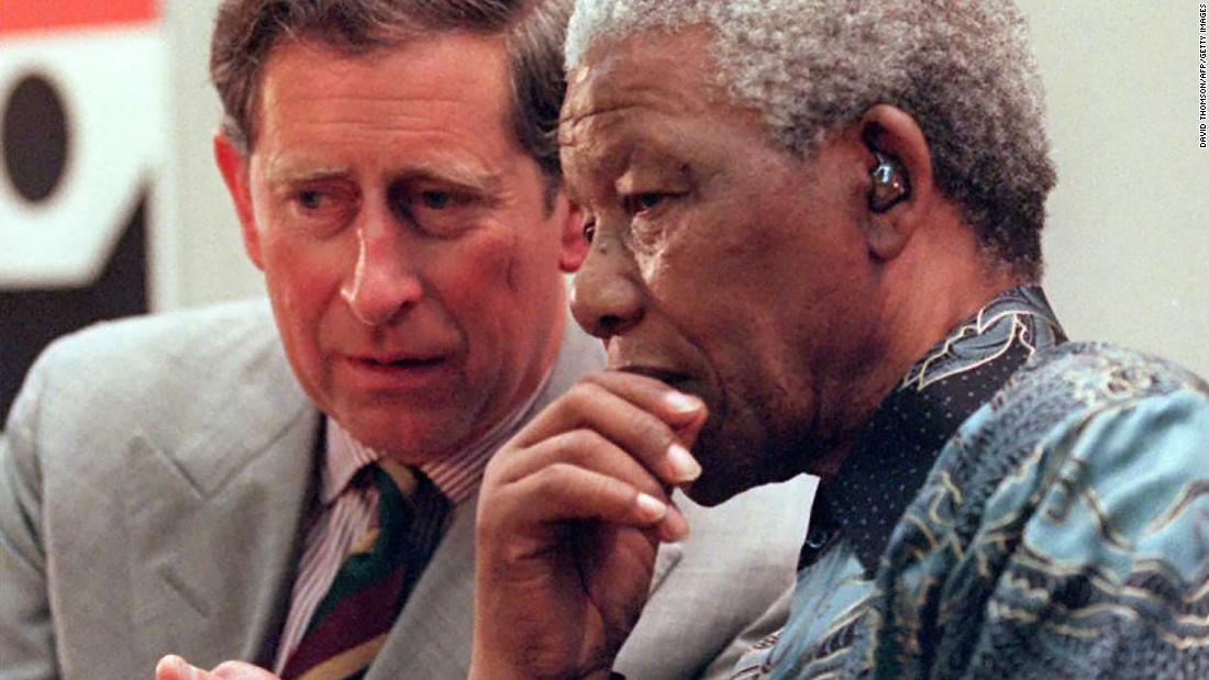 South African President Nelson Mandela talks with Prince Charles in London in July 1996.