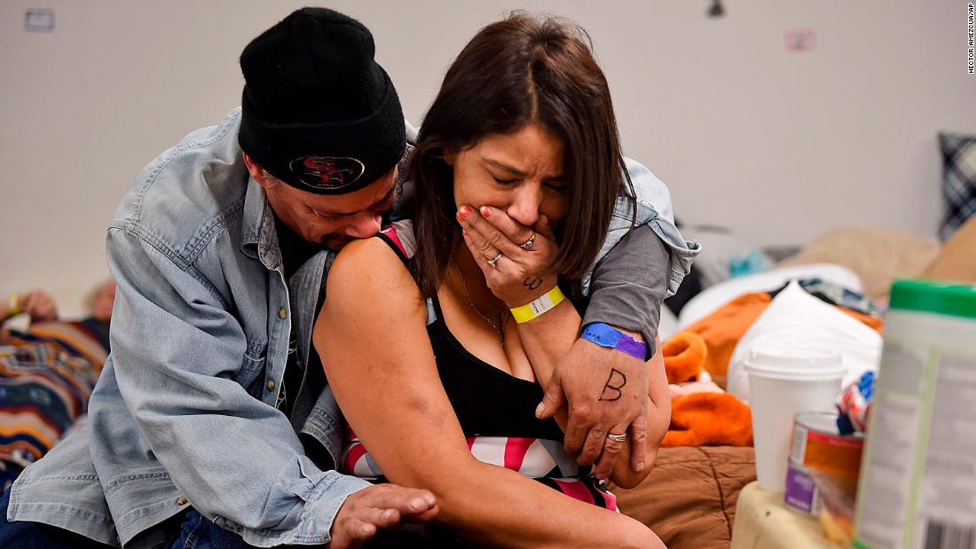 Joseph Grado and his wife, Susan, embrace at a shelter in Chico on November 12. The Camp Fire destroyed their home.