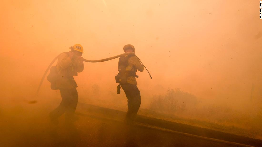 Firefighters battle a fire in Simi Valley on November 12.