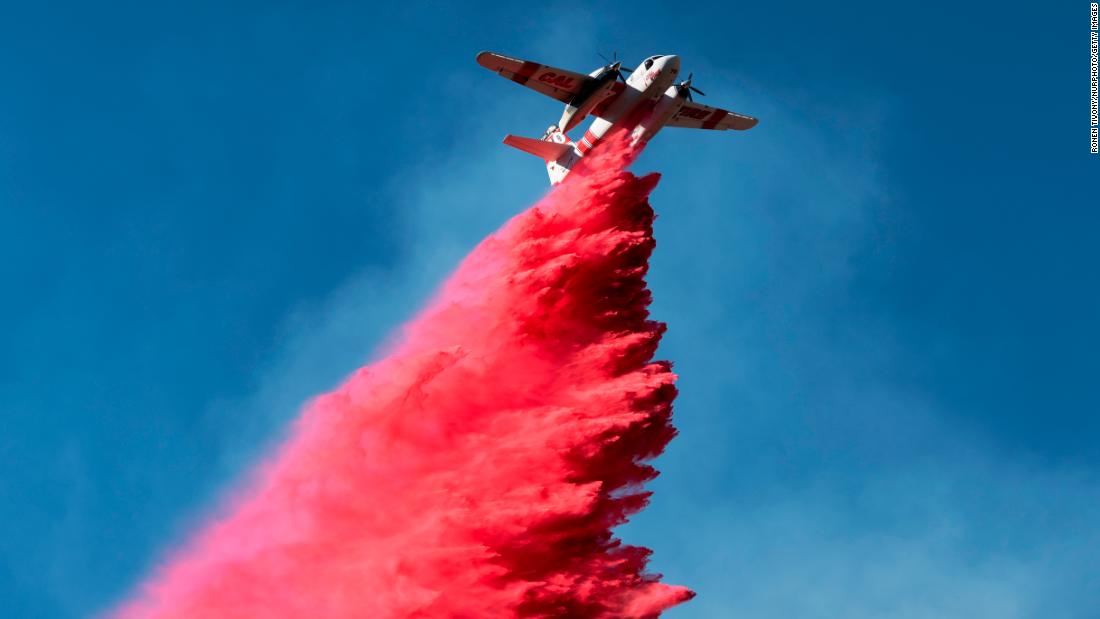 A plane drops fire retardant on the Woolsey Fire near Malibu on November 12.