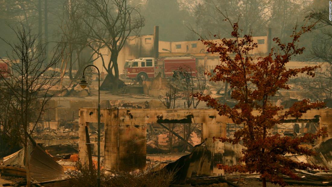 A fire truck drives through part of Paradise on November 13.