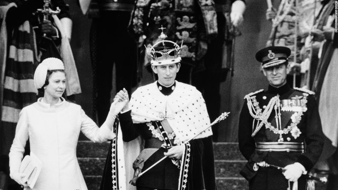 Queen Elizabeth II presents Charles to the people of Wales after his investiture as the Prince of Wales in July 1969.