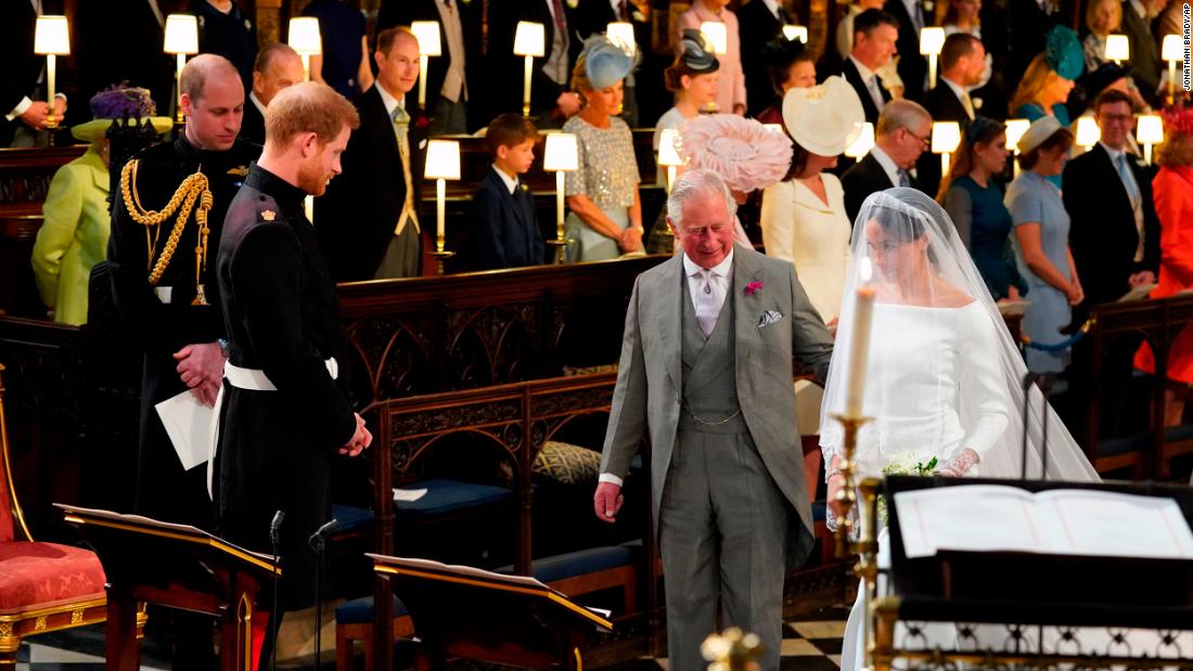 Charles accompanies his future daughter-in-law, Meghan Markle, as she is married to Prince Harry in May 2018.