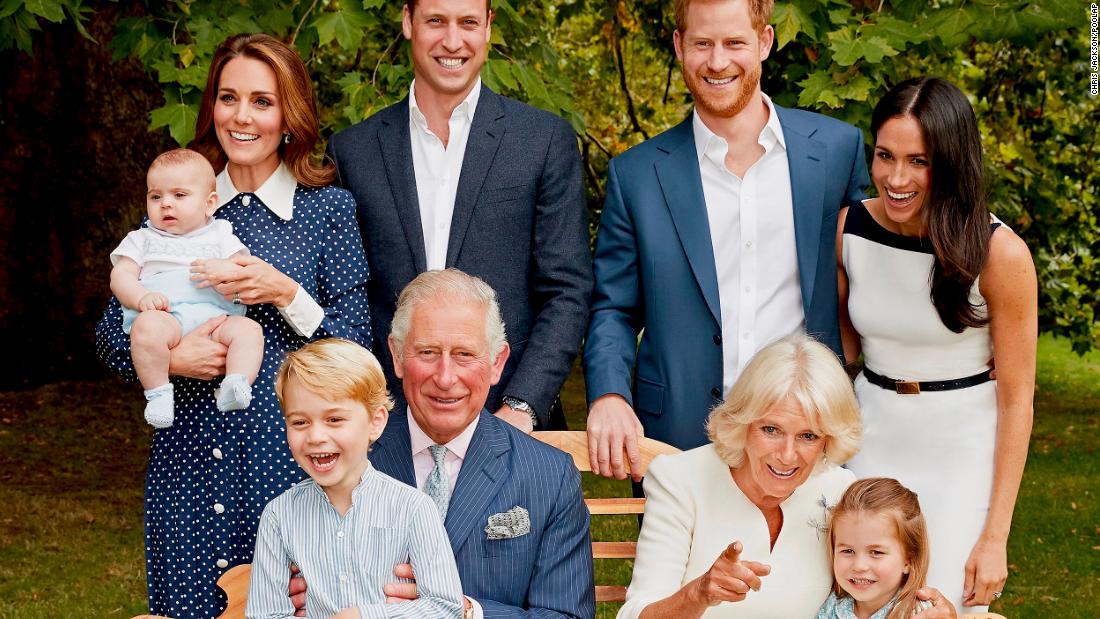 Charles poses with family members for an official portrait to mark his 70th birthday. He&#39;s holding his grandson Prince George as Camilla sits next to his granddaughter, Princess Charlotte. In the back row, from left, are his grandson Prince Louis; his daughter-in-law Catherine; his son Prince William; his son Prince Harry; and his daughter-in-law Meghan.
