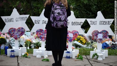 A woman mourns at a memorial outside the Tree of Life synagogue in Pittsburgh.