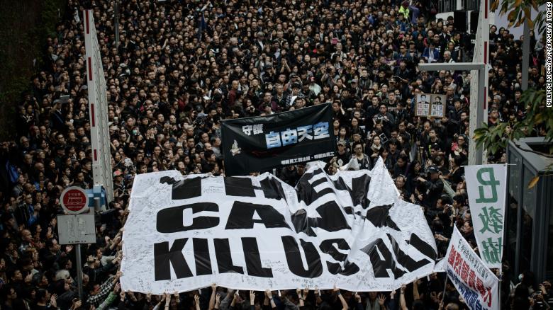 Protesters display a large banner during a rally to support press freedom in Hong Kong on March 2, 2014.