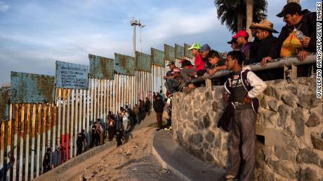 Central American migrants gathered near the US-Mexico border fence in Tijuana on Tuesday. 