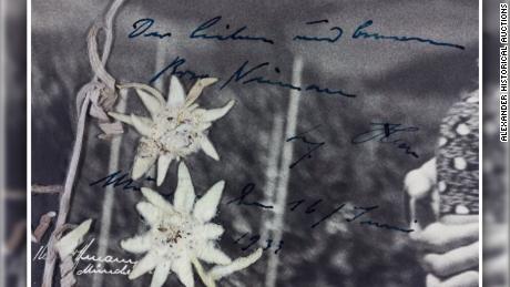 A close-up shot of Hitler's handwritten message on the photograph, translated by the auction house as saying "The dear and (considerate?) Rosa Nienau Adolf Hitler Munich, the 16th June 1933."