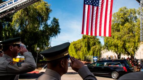 A hearse carrying the coffin of Ventura County Sheriff Sgt. Ron Helus is driven into The Calvary Community Church for his memorial service on November 15, 2018 in Westlake, California.