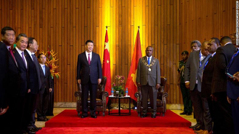 China's President Xi and Papua New Guinea's Governor General Bob Dadae stand before a meeting at Parliament House in Port Moresby on November 16.