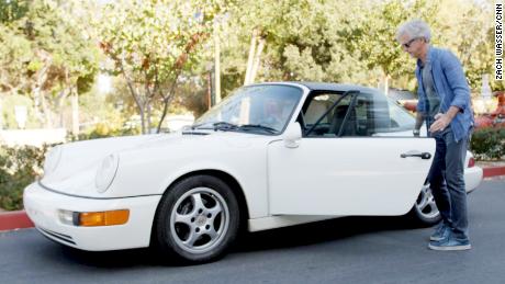 John Krafcik getting into his Porsche 911.