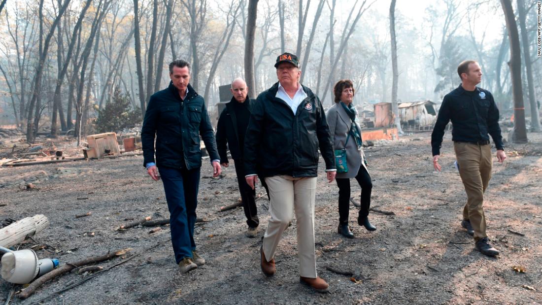 From left, California Gov.-elect Gavin Newsom, California Gov. Jerry Brown, President Donald Trump, Paradise Mayor Jody Jones and FEMA Administrator Brock Long survey damage left by the Camp Fire in Paradise, California, on Saturday, November 17. The death toll from the Camp Fire has risen to 76 and more than 1,200 people remain unaccounted for.