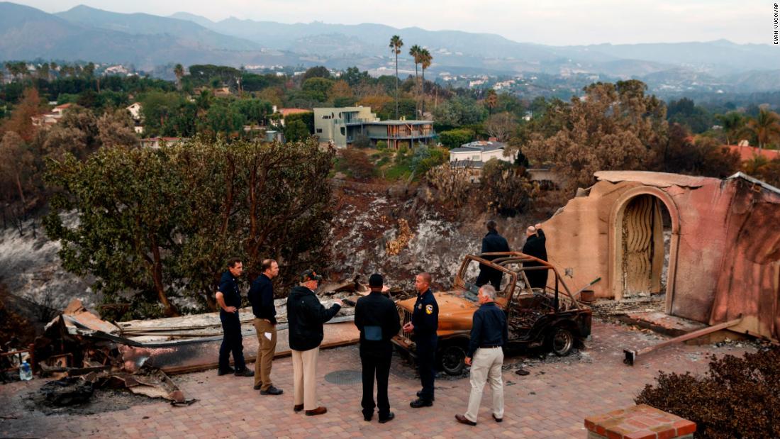 President Donald Trump visits a neighborhood impacted by the Woolsey Fire in Malibu, California, on November 17. 